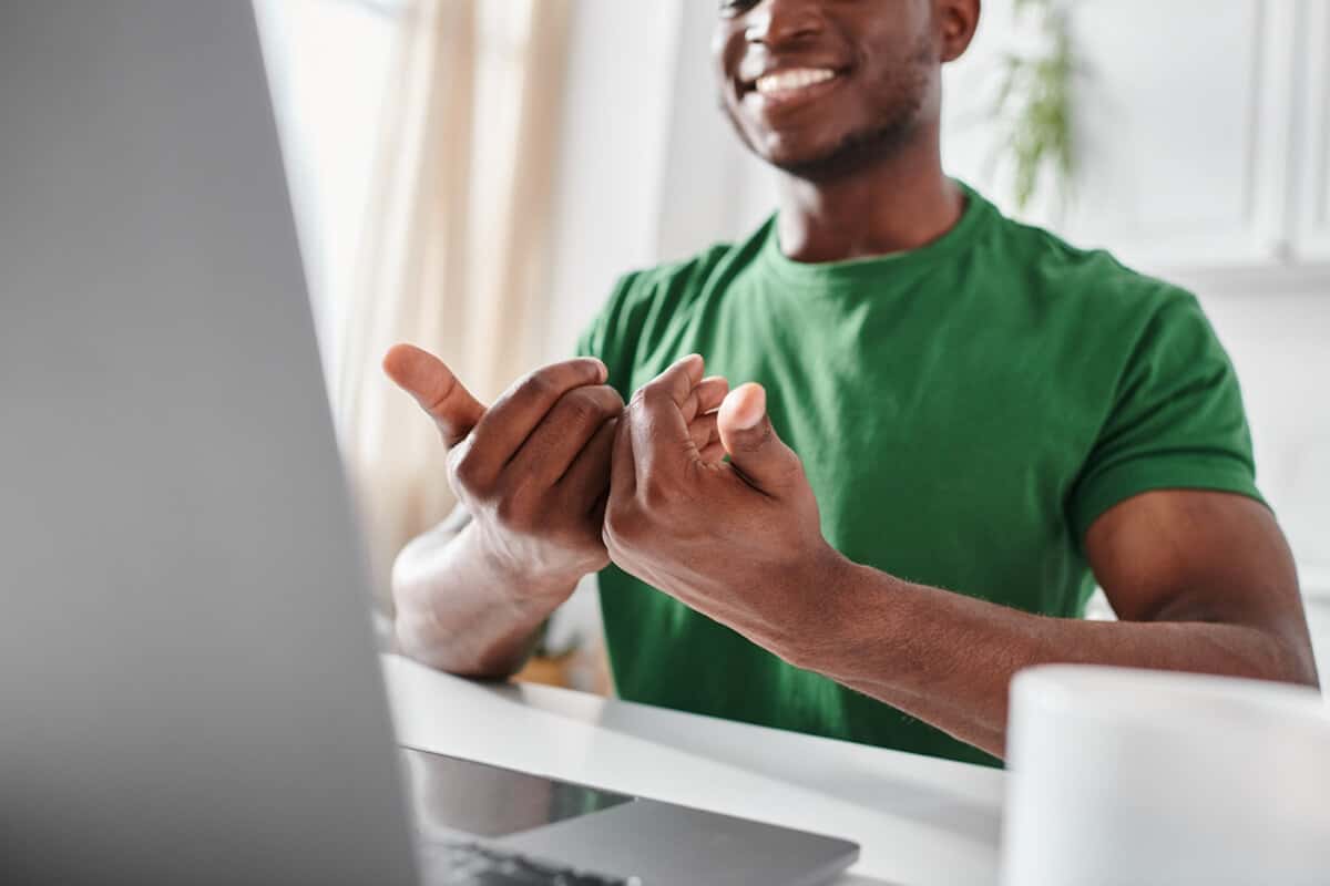 A person using sign language while on a video call